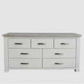 White dresser with multiple drawers on a white background